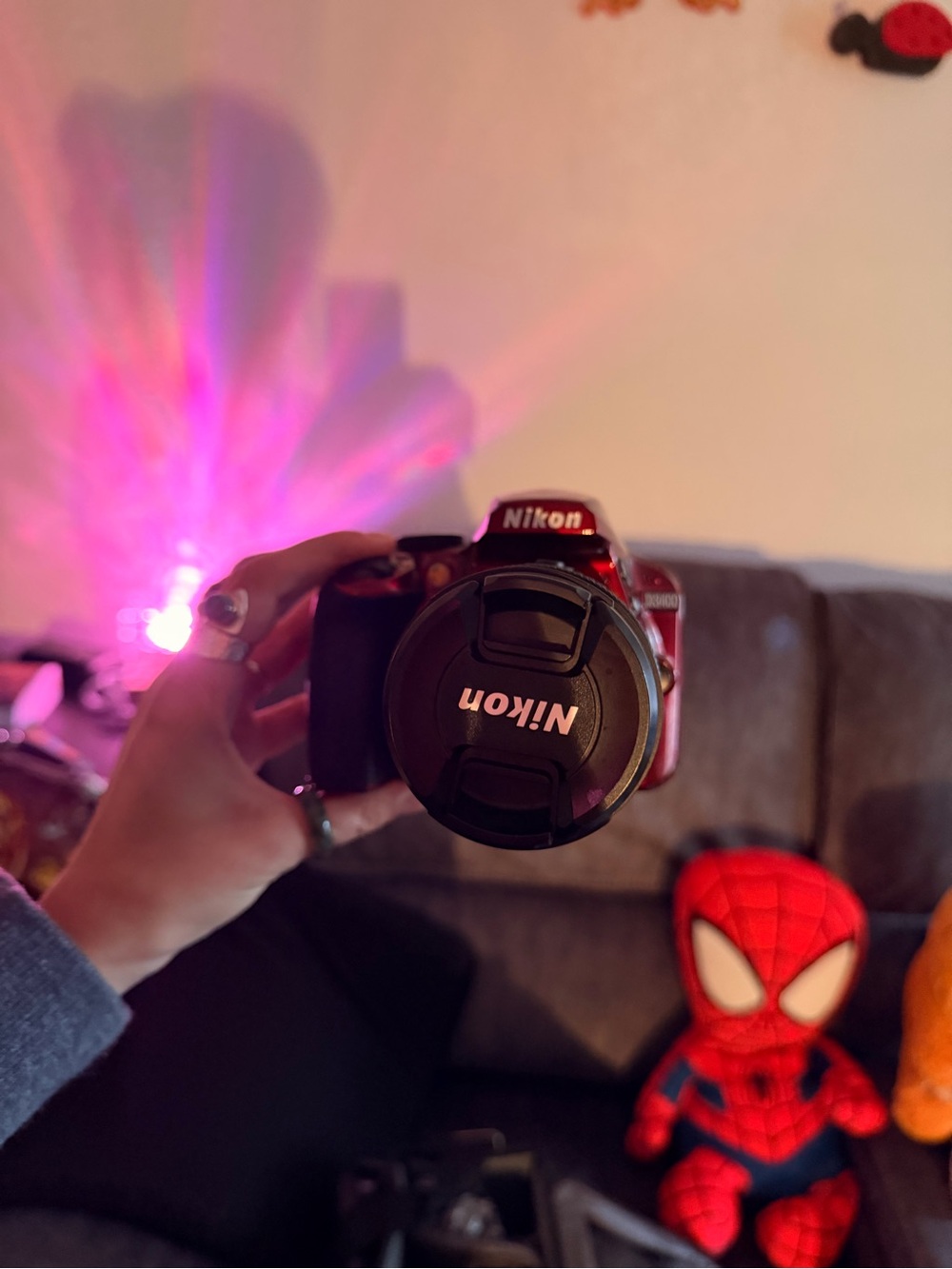 Nikon red DSLR with Nikon lens cap